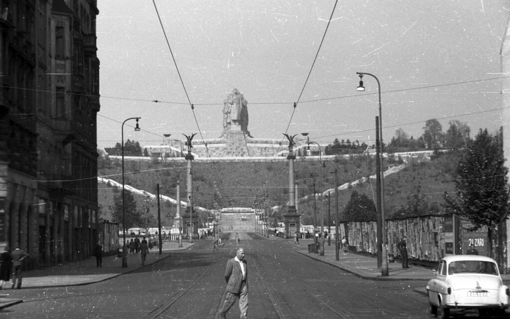 photo of stalin statue on the hill from paris street